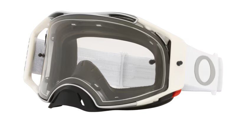Maschera MTB Oakley Airbrake MX con telaio e fascia bianchi e lente trasparente, vista di tre quarti su fondo bianco
